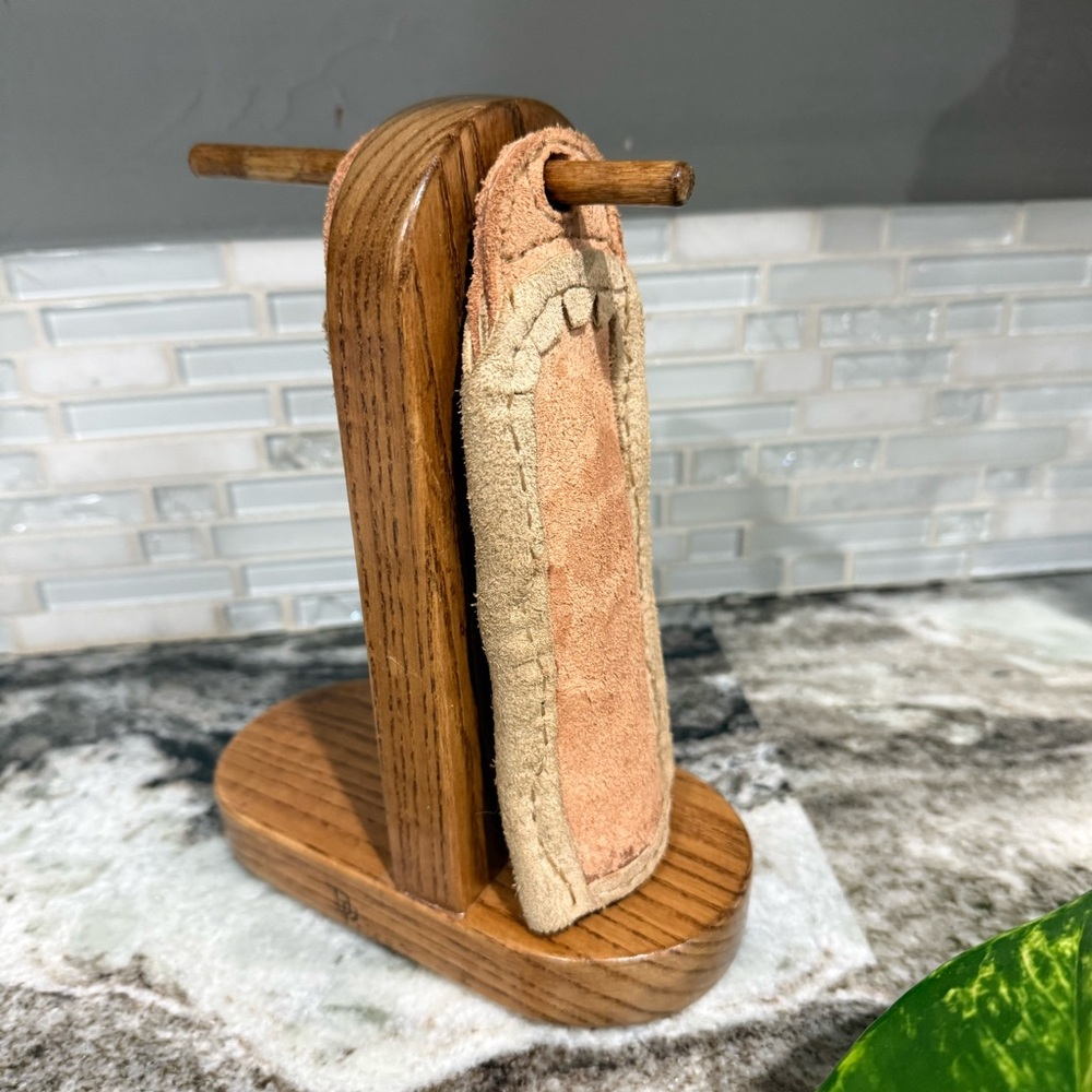 Beautiful handmade wood stand for cast handle protectors to hang.